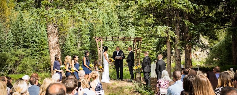 Rustic Iron Wedding Arbor rental & White Garden Resin Ceremony Chairs