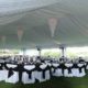 event rentals near Denver -Fabric Lined Tent With wedding chandelier rental & Chair Covers With Sashes
