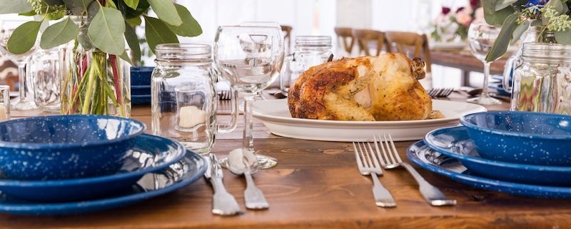 Farm Table With Hammered Silverware, Mason Jar Glasses & Western Blue Plates