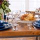 Farm Table With Hammered Silverware, Mason Jar Glasses & Western Blue Plates