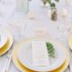 Place Setting With Deco Silverware, Napa Glassware, White wedding china rental & Gold chargers wedding in Vail, Colorado