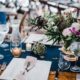 Farm Table With Square Plates, Hammered Flatware, Water Carafs & Stemless Wine Glasses